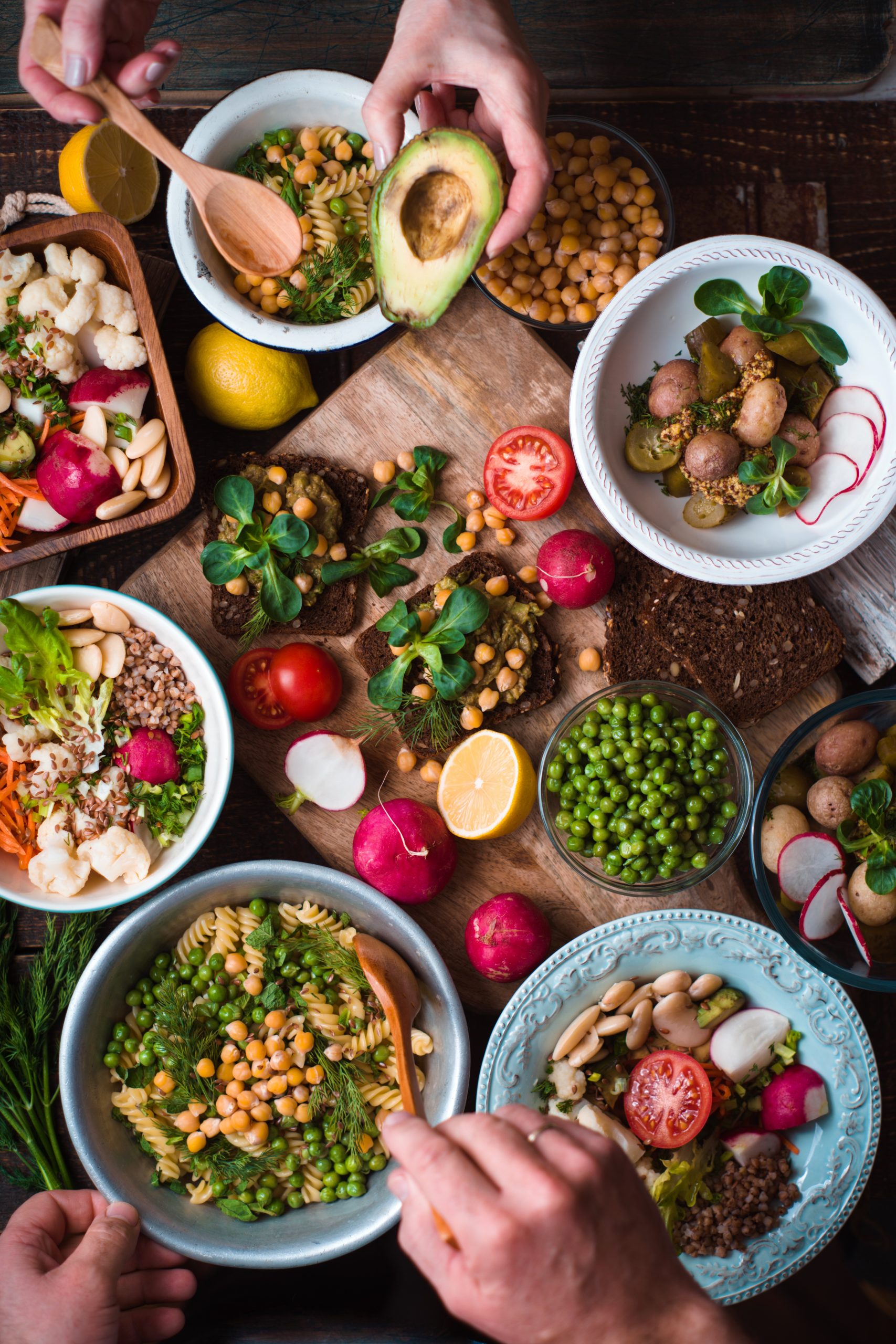Feast with vegetable salads, fruits and sandwiches vertical food combining